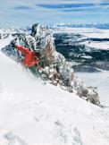 a man riding a wave on top of a snow covered slope,outdoor,snow,skiing,mountain,ice,nature,snowboarding,glacier,ski,glacial landform,wave,slope